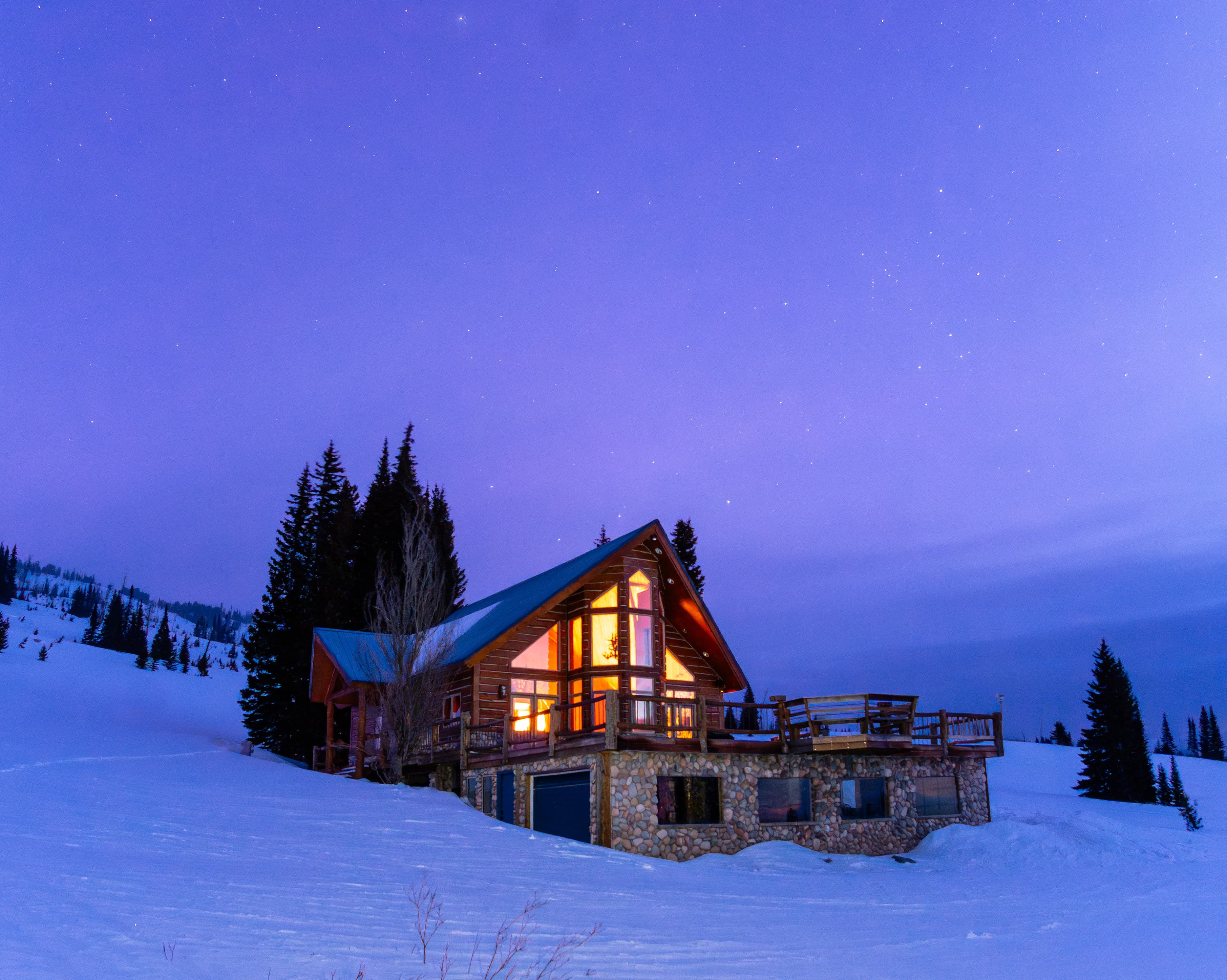 Pilots Roost glowing beneath a winter night sky.